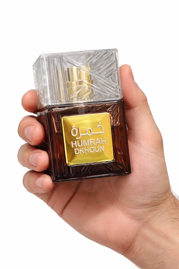 Humrah Dkhoun eau de parfum bottle in hand