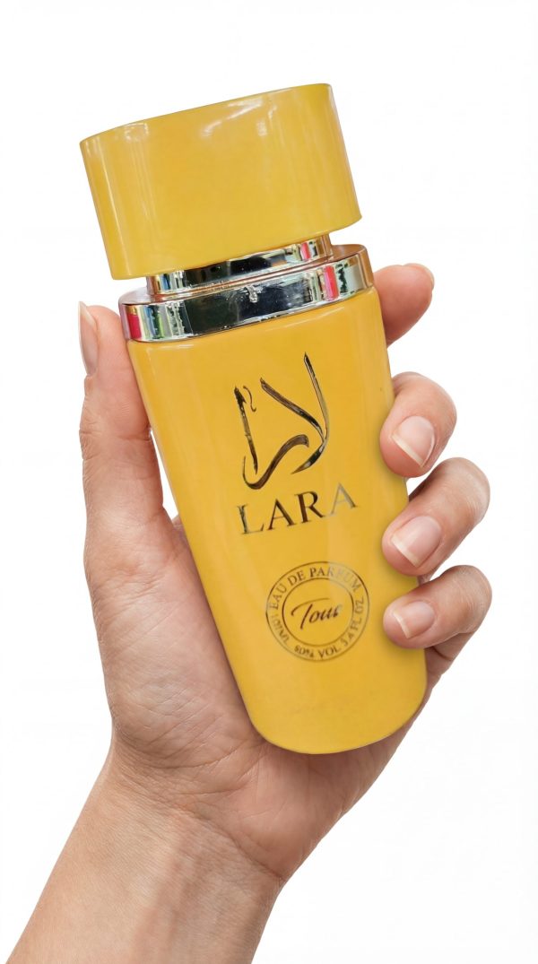 Lara Tous eau de parfum bottle in hand