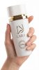 Lara White eau de parfum bottle in hand