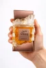 Ateeq extrait de parfum 100 ml, показан в ръка за реална представа за размера и масивния луксозен дизайн