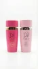 Lara Candy + Lara Pink – официално изображение Lara Candy и Lara Pink eau de parfum 2x100 ml комплект от два дамски парфюма с розови бутилки на бял фон