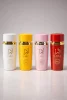 Lara White + Tous + Pink + Rouge – официално изображение Lara White Tous Pink Rouge eau de parfum комплект от четири дамски парфюма с бяла, жълта, розова и червена бутилка на бял фон