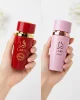 Lara Rouge + Extrait в ръка Lara Rouge + Lara Extrait Eau de Parfum 2 x 100 ml в ръка